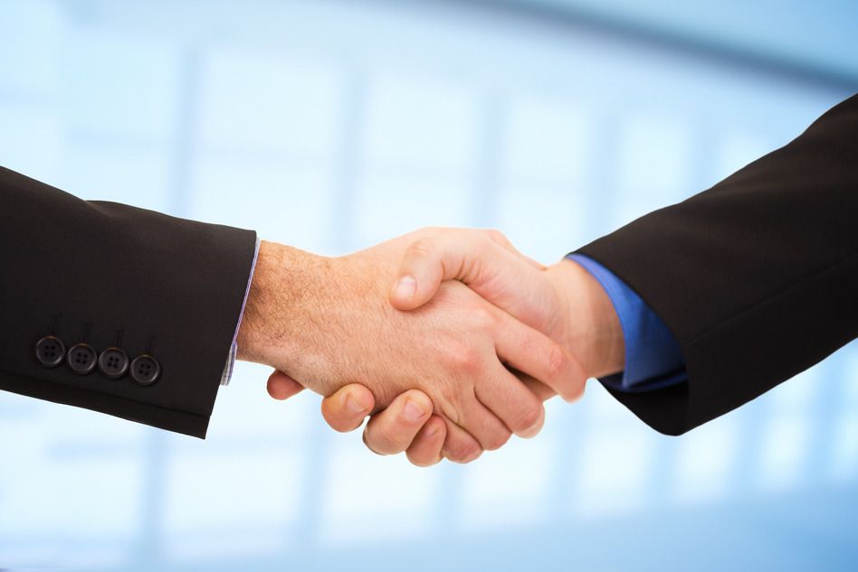 Two businessmen shaking hands